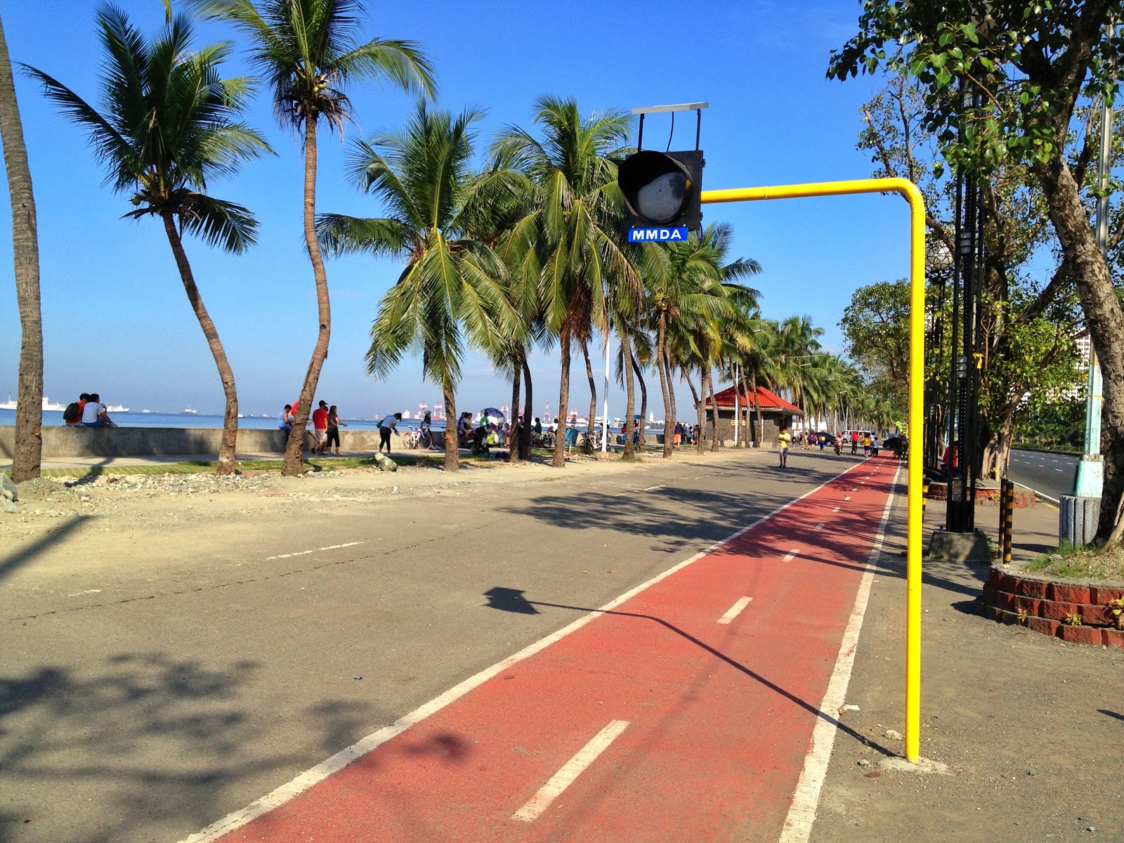 Riding a folding bike around Manila New Bike Lane Along The Manila Bay Boardwalk