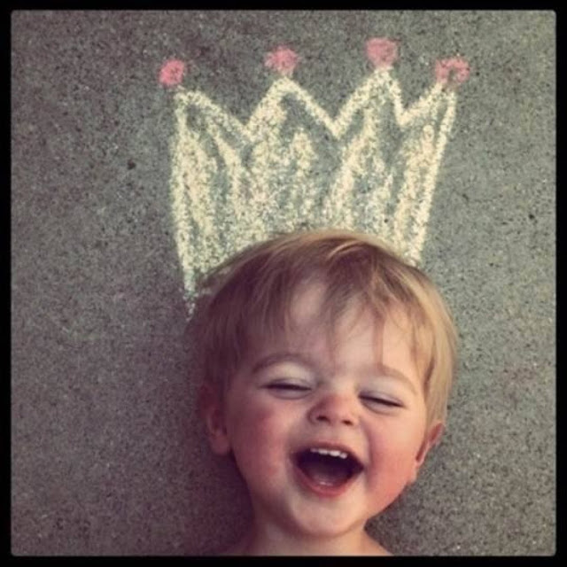 A happy girl with a sidewalk chalk crown. Who's Your Daddy? marchmatron.com