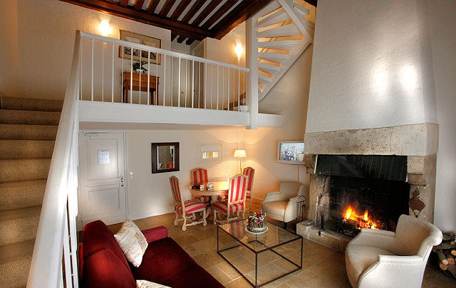 A warm and inviting ambiance fills this cozy triplex, one of six styles of accommodations. Photo: Courtesy of Les Manoirs de Tourgéville.