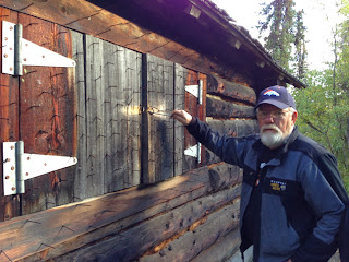 Savage River Cabin at Denali Park with nails on shutters. Anti-bear device on an Alaska log cabin.