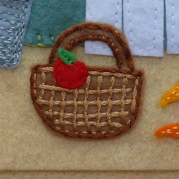 Couched threads embroidered brown felt wicker basket