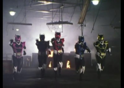 The Psycho Rangers, evil power rangers stand in a burning building