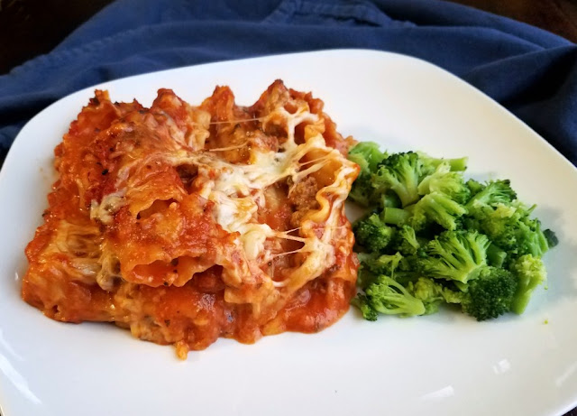 My Maw-Maw's lasagna has a few surprising ingredients that likely make it a bit different from the one you grew up with, but it is so delicious. You have to make some for dinner soon! piece of american lasagna with broccoli on dinner plate
