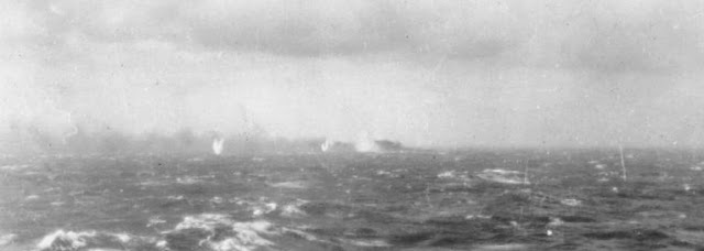 Battle of Atlantic - The Final Battle  27 May 1941 Surrounded by shell splashes, Bismarck burns on the horizon.