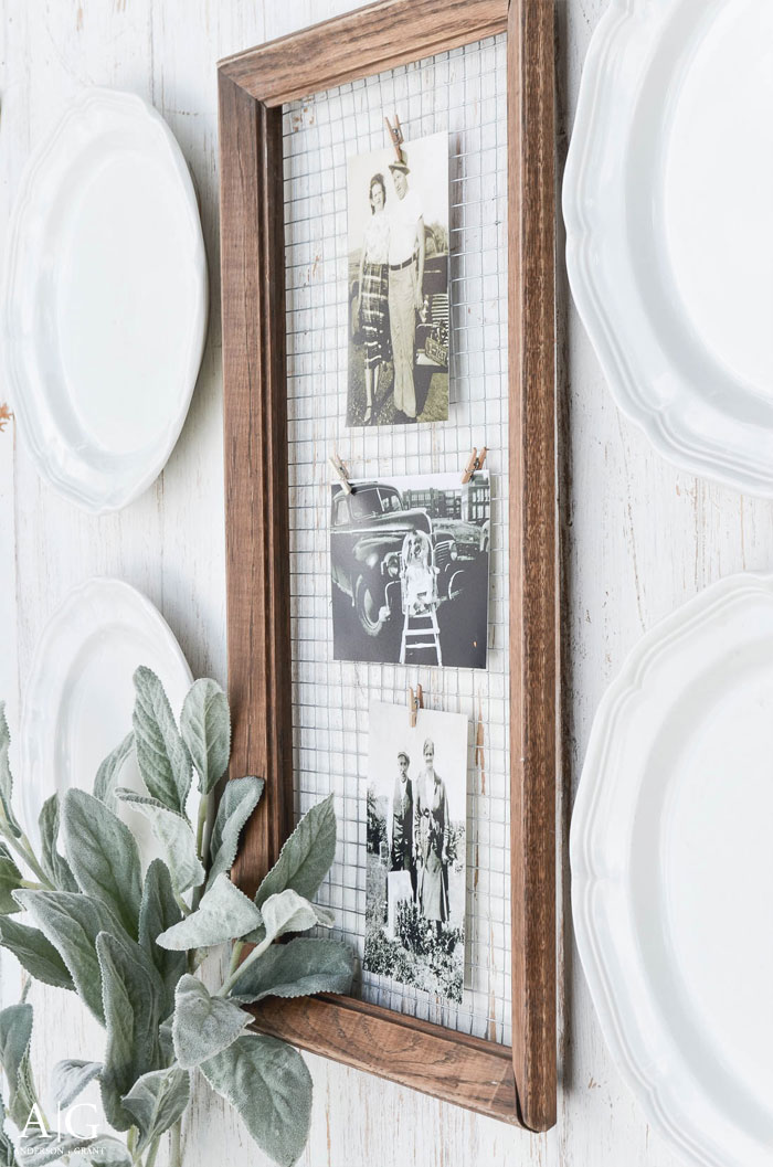 An old wood frame has been turned into a unique way to display photos with a little hardware cloth and clothespins.  ||  www.andersonandgrant.com