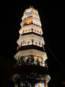 Fufeng Pagoda (阜峰文塔) with lights on at night in Zhongshan