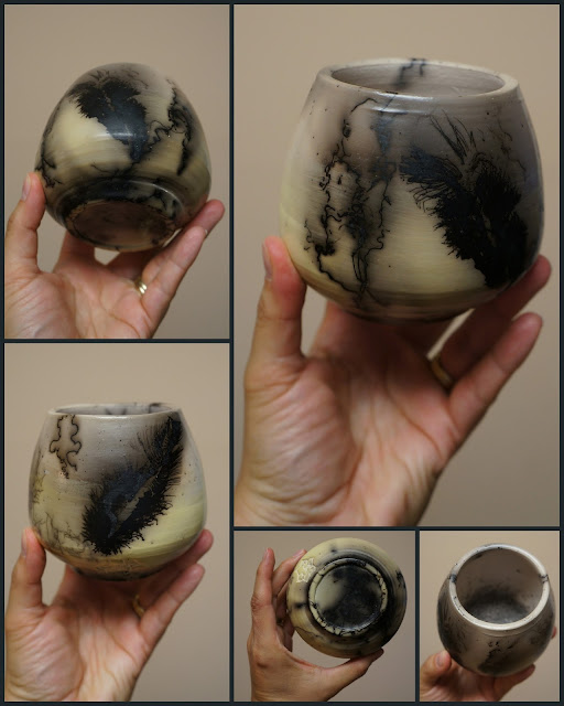 Unique beautiful handthrown horsehair raku pottery vase with feather imprints.