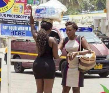 From a movie or what? Viral photos of a bootilicious lady on mini dress selling satchet water in Ghana