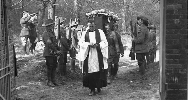 Photo of the funeral of Manfred von Richthofen, The Red Baron, April 22, 1918, No.3 Squadron lays to rest an old adversary, at Bertangles Cemetery, France. A priest walks through church gates followed by Allied soldiers carry coffin as other soldiers salute. Dogfights and other stories of pilots. marchmatron.com Photo of the funeral of Manfred von Richthofen, The Red Baron, April 22, 1918, No.3 Squadron lays to rest an old adversary, at Bertangles Cemetery, France. A priest walks through church gates followed by Allied soldiers carry coffin as other soldiers salute. Dogfights and other stories of pilots. marchmatron.com