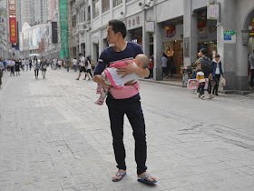 many carrying a baby
