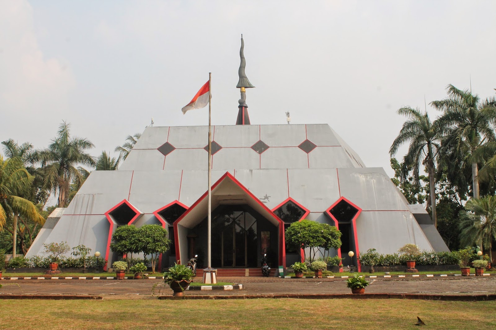  The image shows the Museum Pusaka Indonesia, a museum in Jakarta, Indonesia, which houses a collection of Indonesian cultural heritage and historical artifacts.