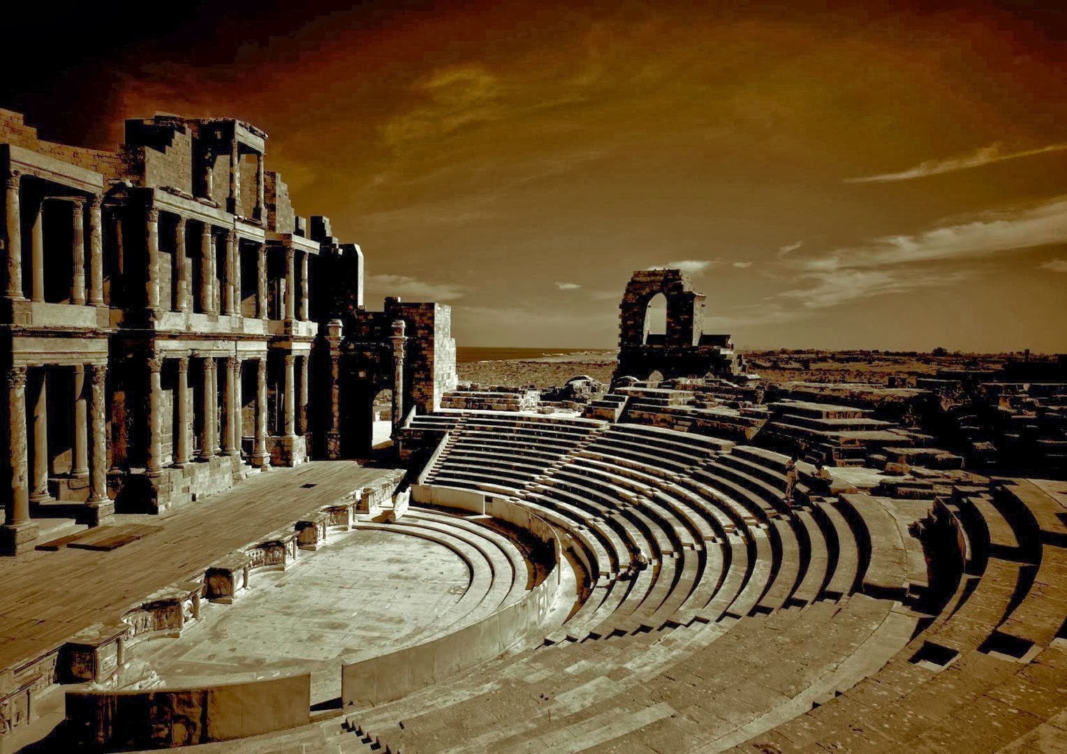 Ancient theater. Оранж Франция амфитеатр. Театр в Сабрата Ливия. Франция оранж античный театр. Древнеримский театр.