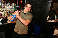 Bartender shaking a drink in a nightclub