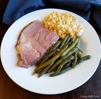 These garlic soy green beans are easy, delicious and cook quickly with the help of a pressure cooker. plate with ham, green beans and creamed corn on it