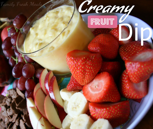 Pineapple Fruit Dip served with strawberries, bananas, sliced apples, grapes and chocolate crackers