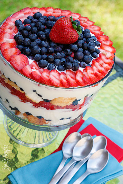 This easy dessert trifle topped with sliced strawberries and fresh blueberries is delicious.