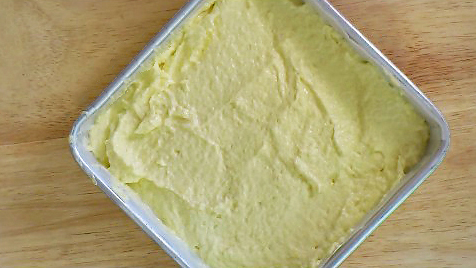 butter cake batter in a cake pan