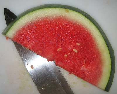 cutting watermelon slices