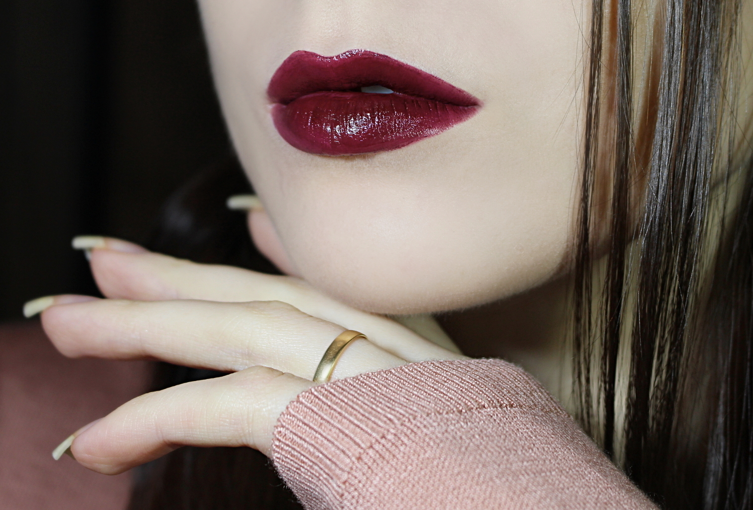 blogger Liz Breygel demonstrates a close-up of her lips with a dark lipstick by City Color Cosmetics