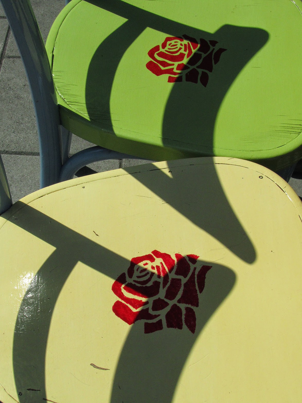 green chairs with red roses