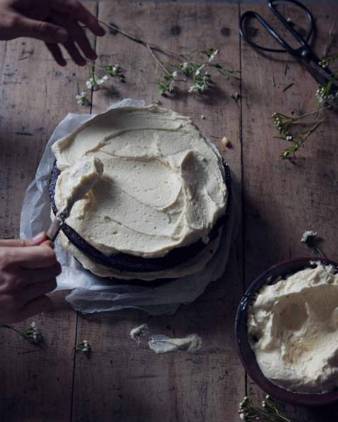 Rustic farm table with homemade cake and buttercream - found on Hello Lovely Studio