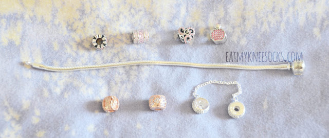 Soufeel Charm Bracelet Review Details on the pink and rose gold sterling silver charm bracelet from Soufeel, a company specializing in crystal-embellished, engraved memorable charms and jewelry, offering a cheaper alternative to popular Pandora charm bracelets.