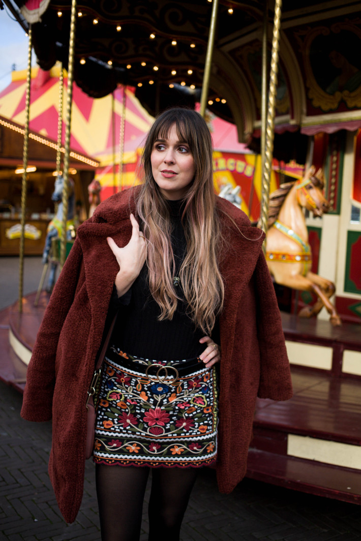 rust coloured teddy coat, embroidered skirt, double circle belt