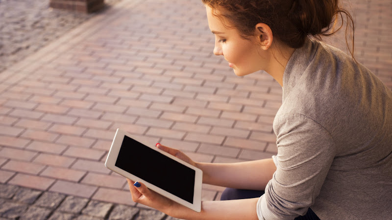Beautiful Woman with an iPad Tablet