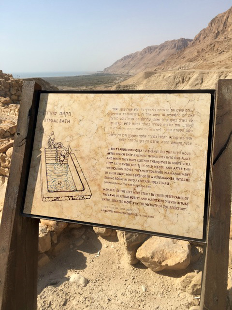 photo of a sign talking about ritual baths in a mikvah in Qumran Israel