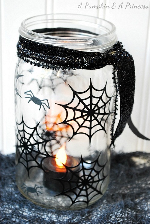 Spiderweb mason jar for Halloween 25 DIY Halloween Mason jar craft ideas. Spider web Mason jar lantern for kids. Mason jar craft ideas for kids. Spider decoration ideas on Mason jar. Ghost decoration on Mason jar. Halloween decorative Mason jar. Halloween Mason jar gift ideas. Halloween party decoration ideas.