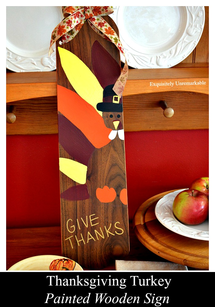 Paint a Thanksgiving turkey wooden sign on an old fan blade to welcome the holiday. It's an easy DIY and super cute, too.