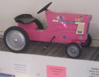 Pink toy tractor in a store