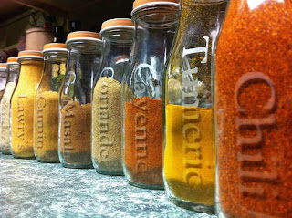 Repurposed Starbucks Frappuccino bottles into spice jars