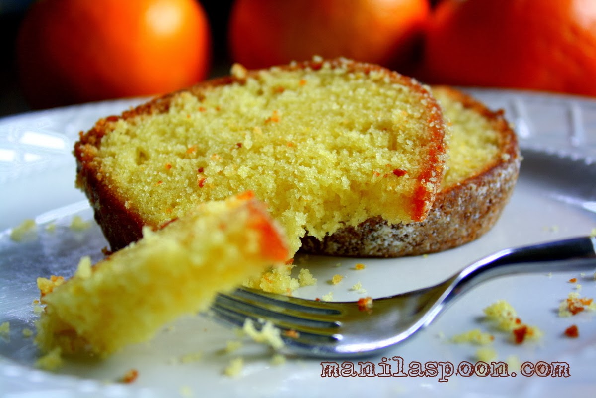 Moist and so delicious, this orange and olive oil cake is bursting with fruity flavors from fresh orange juice and cranberries. Perfect for your Christmas or New Year dessert table! | manilaspoon.com