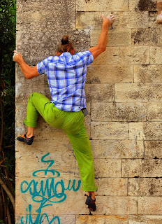 Image of someone climbing a wall