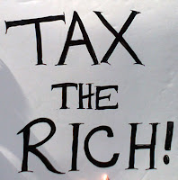 sign saying, tax the rich!