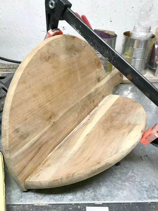 broken cutting board in clamps
