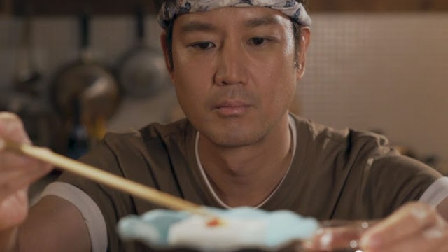 a shot from the film where Ryan makes Jimami Tofu