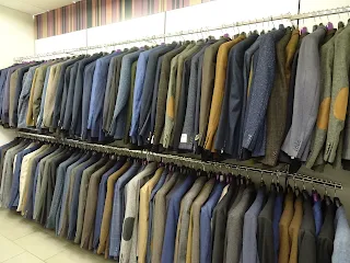 row of tailor made suits slaters glasgow 