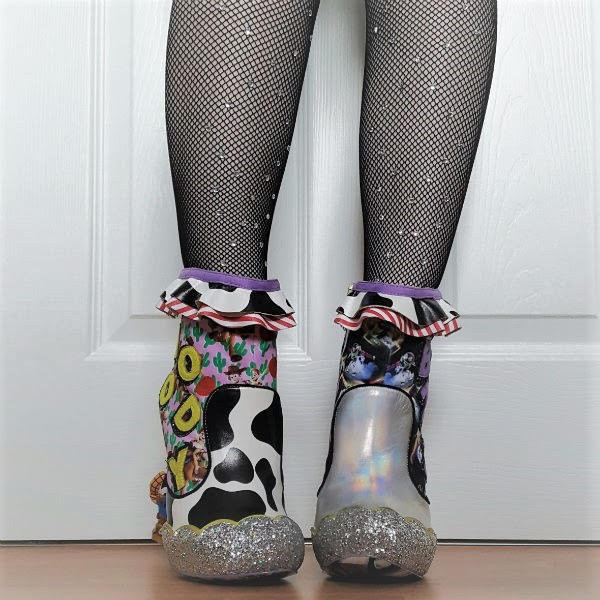 You Are A Toy! ankle boots front legs facing forward wearing jewelled fishnet tights and cow print and holographic ankle boots