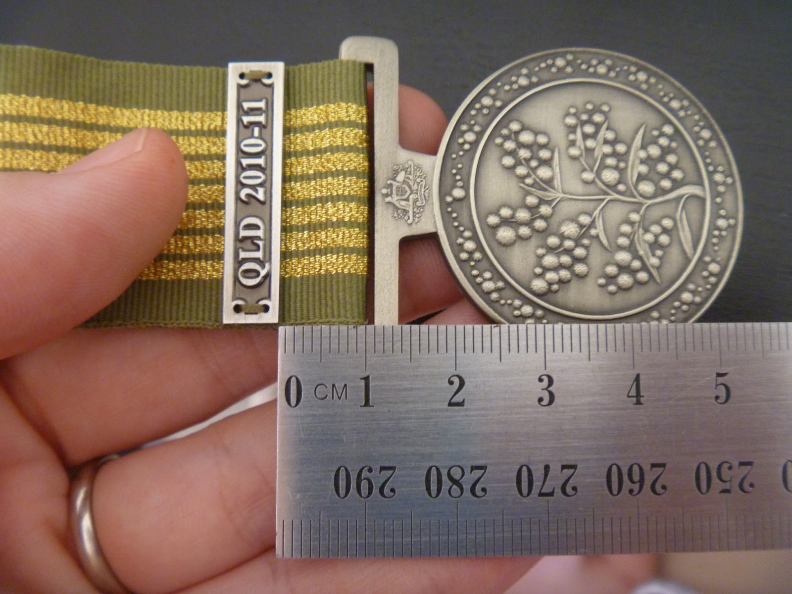 How to sew a clasp to a medal