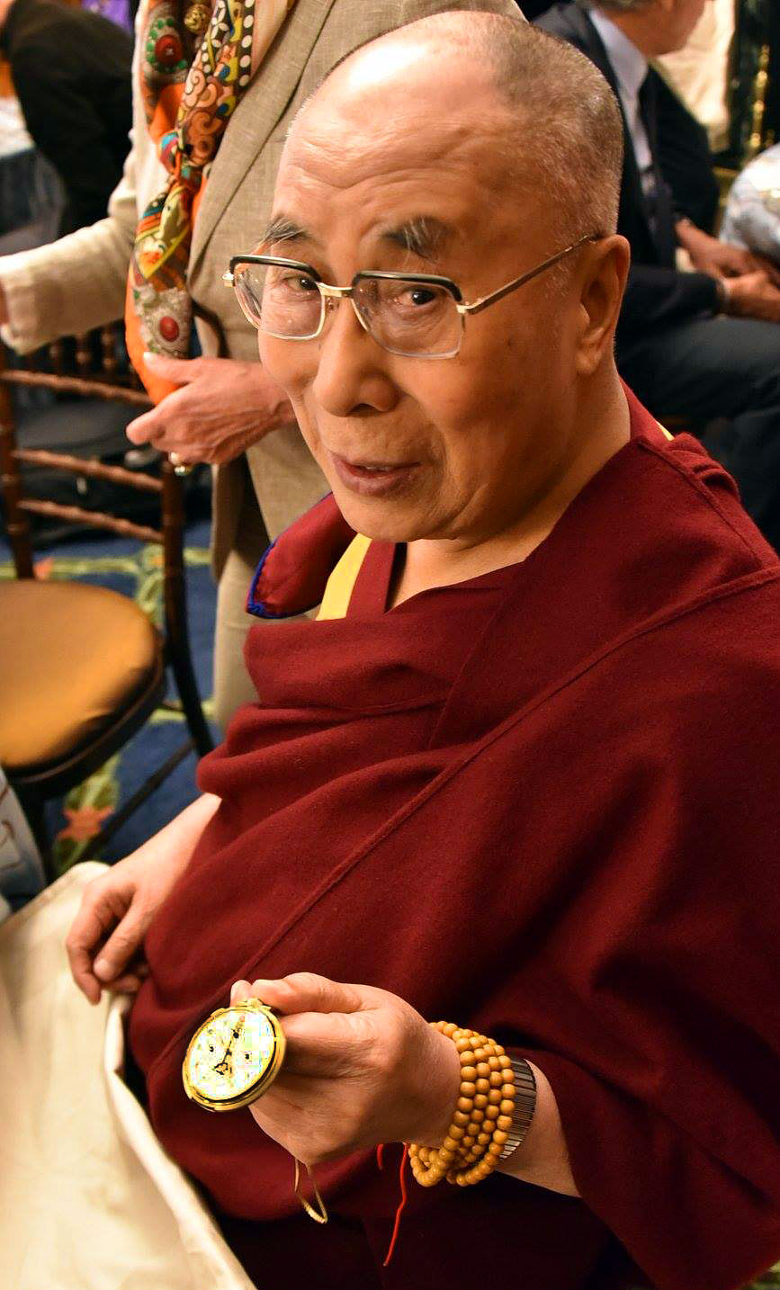 <em>His Holiness Tenzin Gyatso, the 14th Dalai Lama, presents the Patek Philippe 658 gifted to him by FDR (Senator Patrick Leahy)</em>