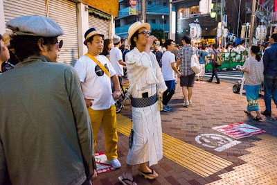 Trad fashion on a Koenji street corner at the Koenji Awa-Odori, 2016. Man in yukata on a Koenji street corner at the 60th Koenji Awa-Odori, Tokyo, Japan, 2016.