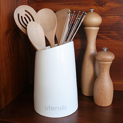 white utensil holder, porcelain - says Utensils