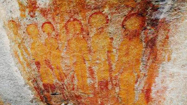 Really old Aliens painted on cave walls and rocks.