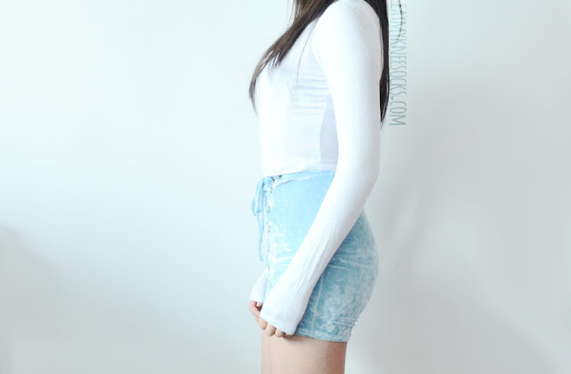 Hand Cooked Karma Fashion Review: Crushed Velvet Lace-Up Shorts A cute outfit featuring the lace-up crushed velvet corset-style high-waisted pastel blue shorts from Home Cooked Karma (Etsy), worn with a semi-sheer white long sleeve crop top.