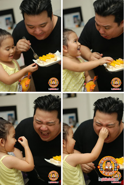father and daughter eating cake