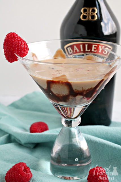 This decadent Chocolate Raspberry Truffletini is a smooth & creamy combination of Bailey's Irish cream, Godiva liqueur, raspberry vodka, & muddled fresh raspberries.