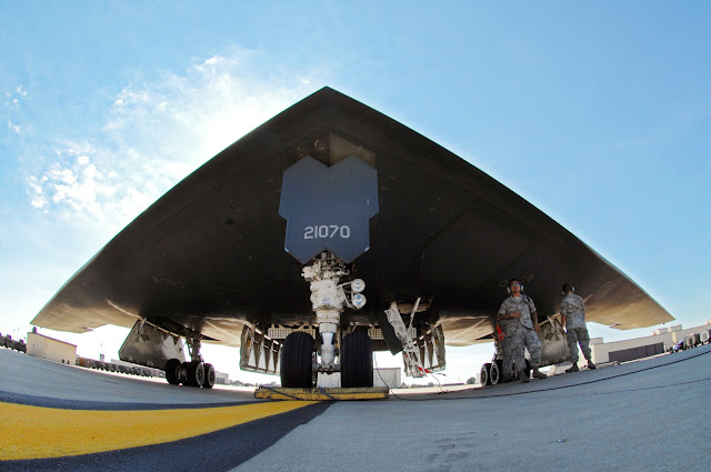 Crew chiefs with the 509th Aircraft Maintenance Squadron prepare a B-2 Spirit for flight 