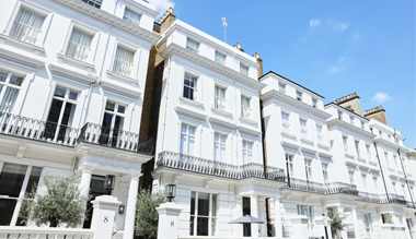 Exterior of white victorian townhouses of The Laslett Hotel in Notting Hill in the heart of West London
